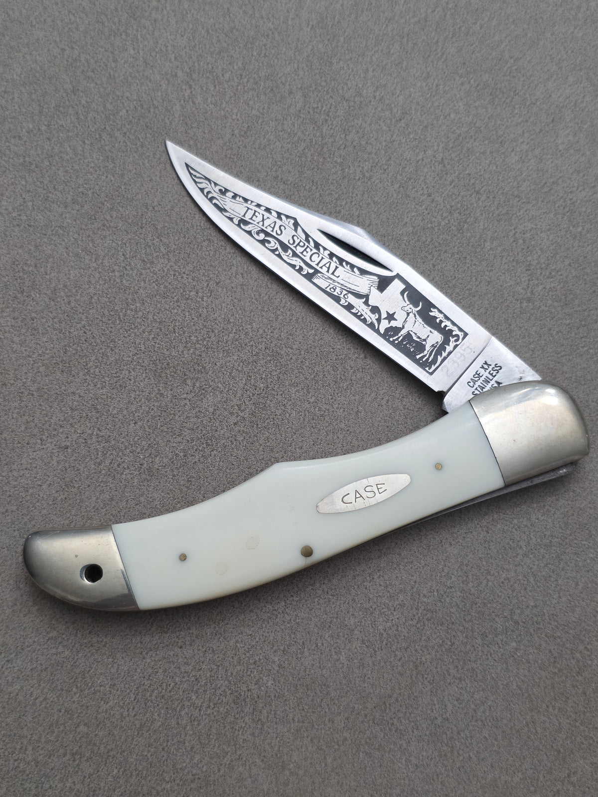 1977 Case XX Stainless Texas Special White Synthetic Folding Hunter