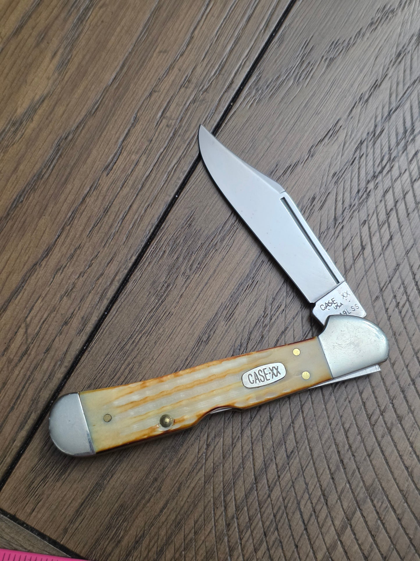 1997 Case XX Burnt Natural Jigged Bone Copperlock with Floating Dots